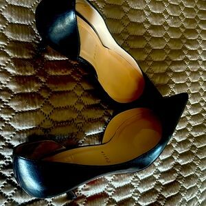 Christian Louboutin shoes. Kitten pointed heels with red bottoms.